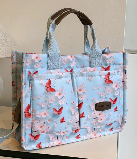 Red butterflies with blue tote bag